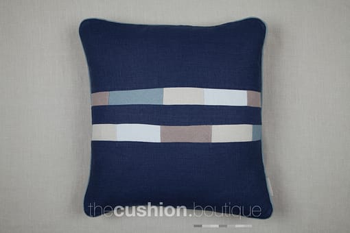 Shades of blue and grey patchwork tiles in stonewashed linen handmade cushion