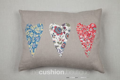 appliqué Liberty heart shapes on grey linen
