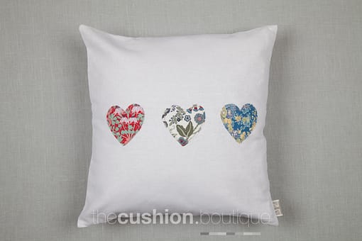 Classic white Linen handmade cushion embellished with Liberty print small hearts